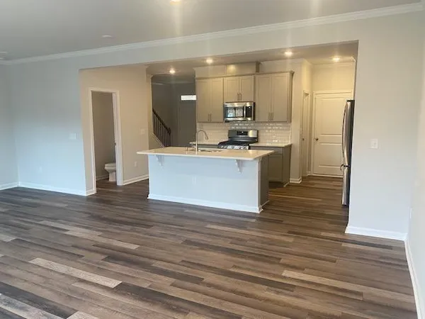a view of kitchen with wooden floor
