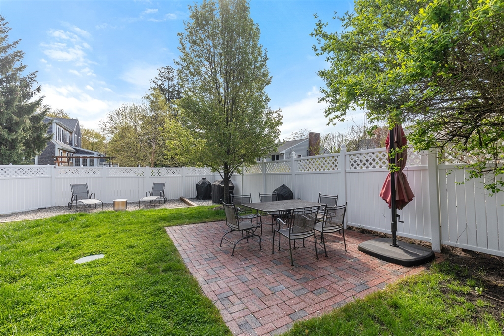 21 Linscott Road Hingham, MA 02043 - Photo 12 of 32 a view of a house with backyard sitting area and garden