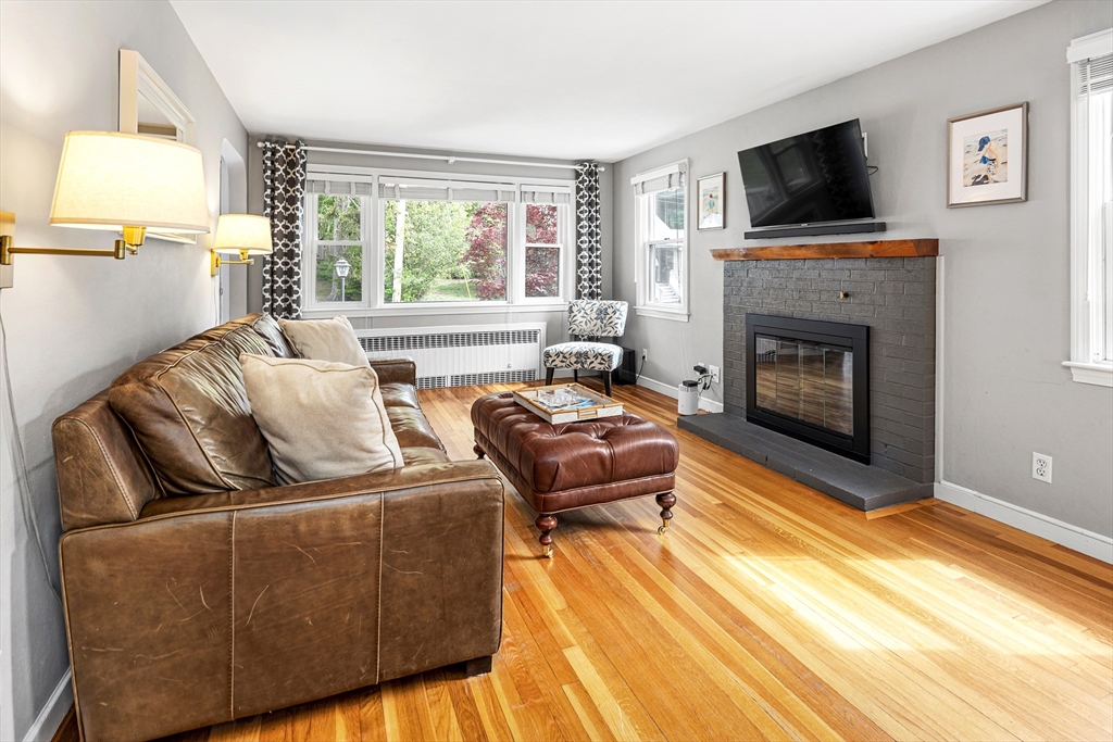 21 Linscott Road Hingham, MA 02043 - Photo 15 of 32 a living room with furniture and a fireplace