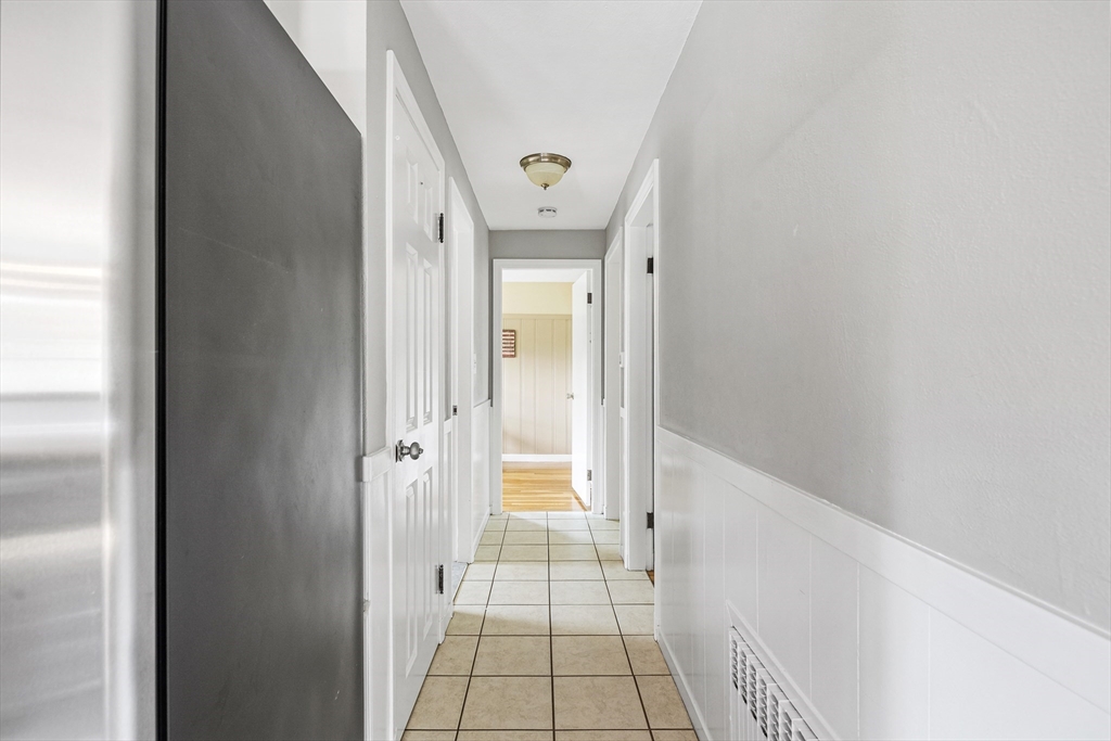 21 Linscott Road Hingham, MA 02043 - Photo 23 of 32 a view of a hallway view with wooden floor and a bathroom