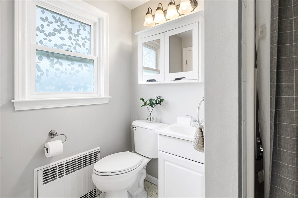 21 Linscott Road Hingham, MA 02043 - Photo 27 of 32 a white toilet sitting next to a bathroom sink