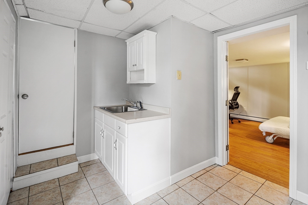 21 Linscott Road Hingham, MA 02043 - Photo 29 of 32 a bathroom with a sink and a shower