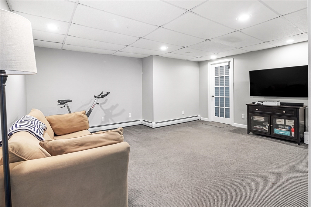 21 Linscott Road Hingham, MA 02043 - Photo 31 of 32 a living room with furniture and a flat screen tv