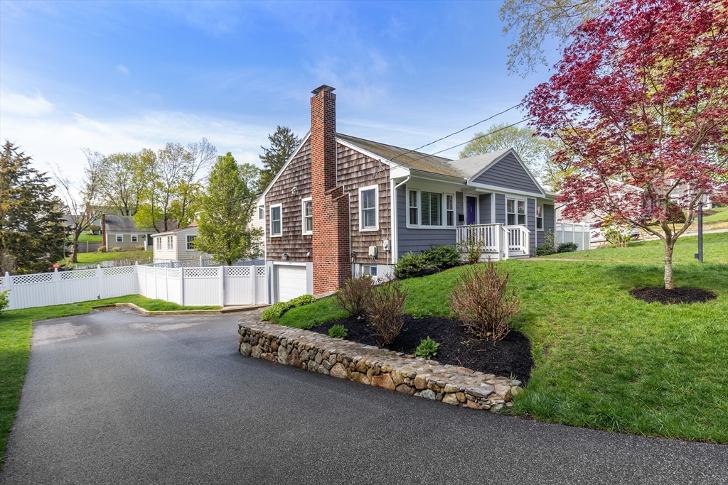 21 Linscott Road Hingham, MA 02043 - Photo 5 of 32 a view of a house with a yard and potted plants
