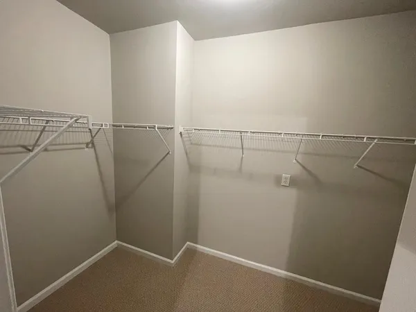 a view of a room with racks on the wall