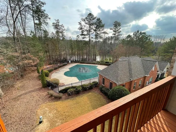 a view of a house with yard and sitting area