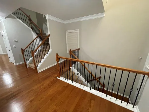 a view of a balcony with wooden floor