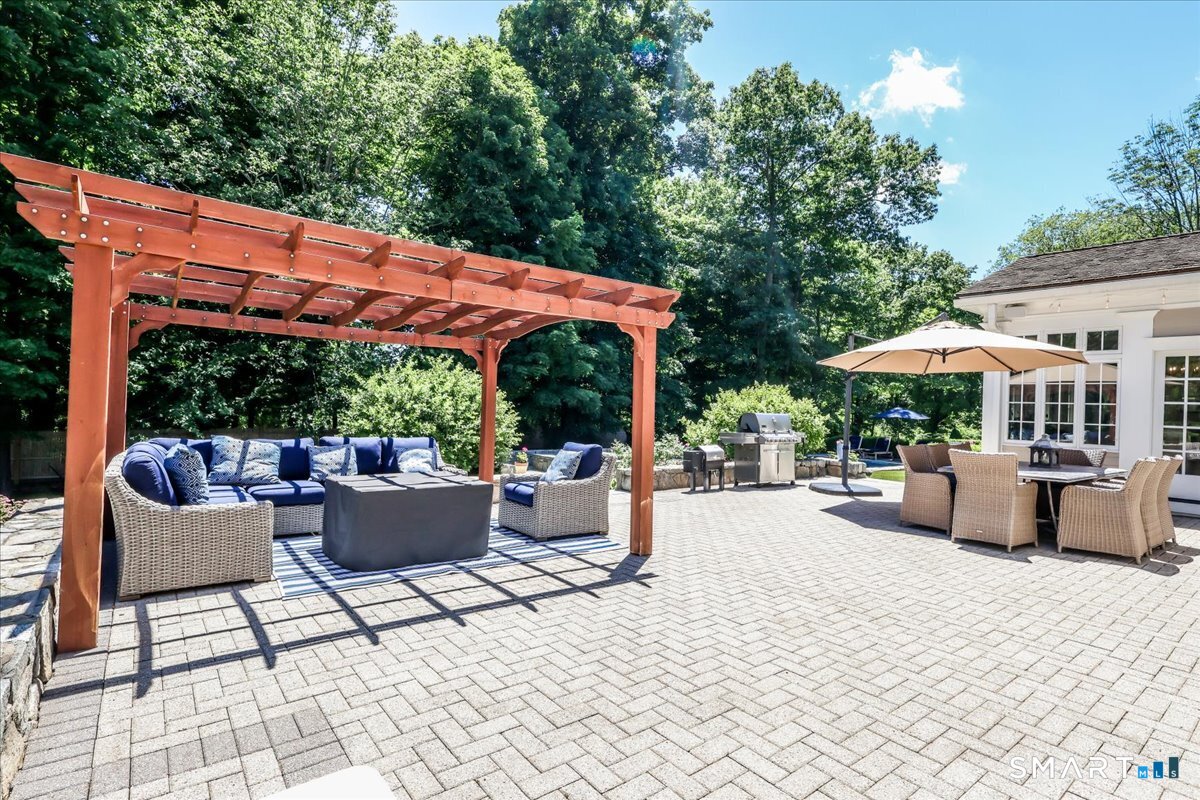 170 Branchville Road Ridgefield, CT 06877 - Photo 33 of 36 Large terrace with sitting area and gas firepit, dining al fresco and heated pool for swimming!