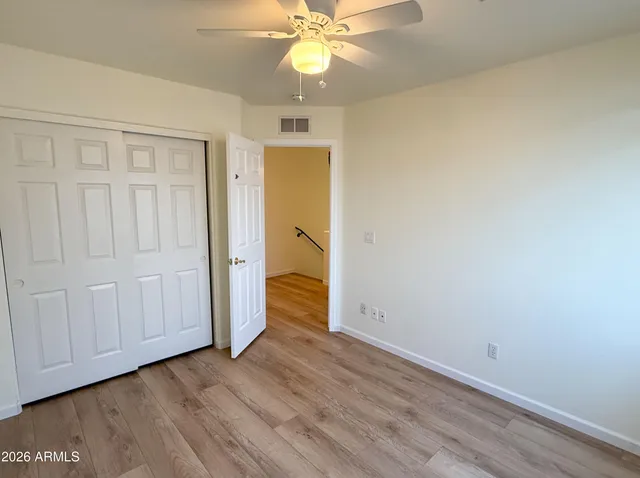 a view of an entryway with wooden floor