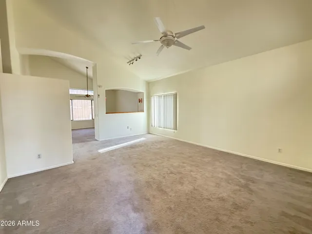 a view of a big room with windows and cabinet