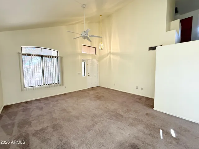 a view of empty room with windows