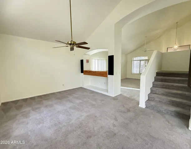 a view of a livingroom with a staircase