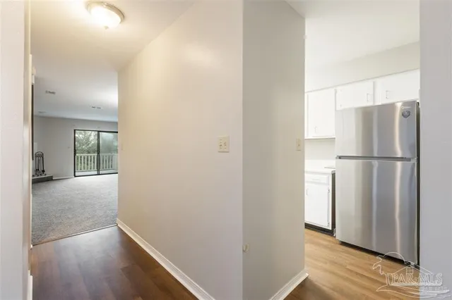 a view of a kitchen with a refrigerator