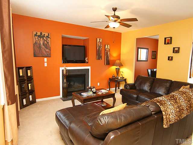 429 Hay River Street Garner, NC 27529 - Photo 2 of 12 a living room with furniture and a fireplace