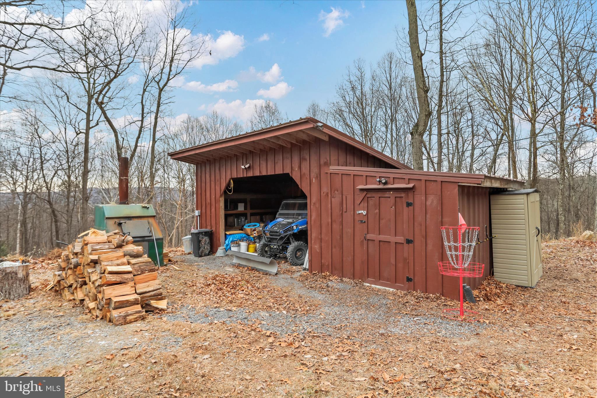 1400 Core Road Romney, WV 26757 - Photo 45 of 57 a view of a wooden house with a large tree and wooden fence