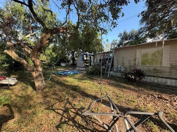 a view of a backyard of the house