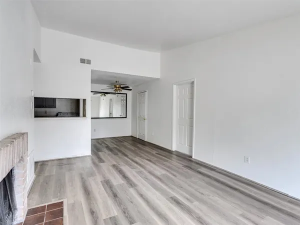 a view of a kitchen cabinets and wooden floor