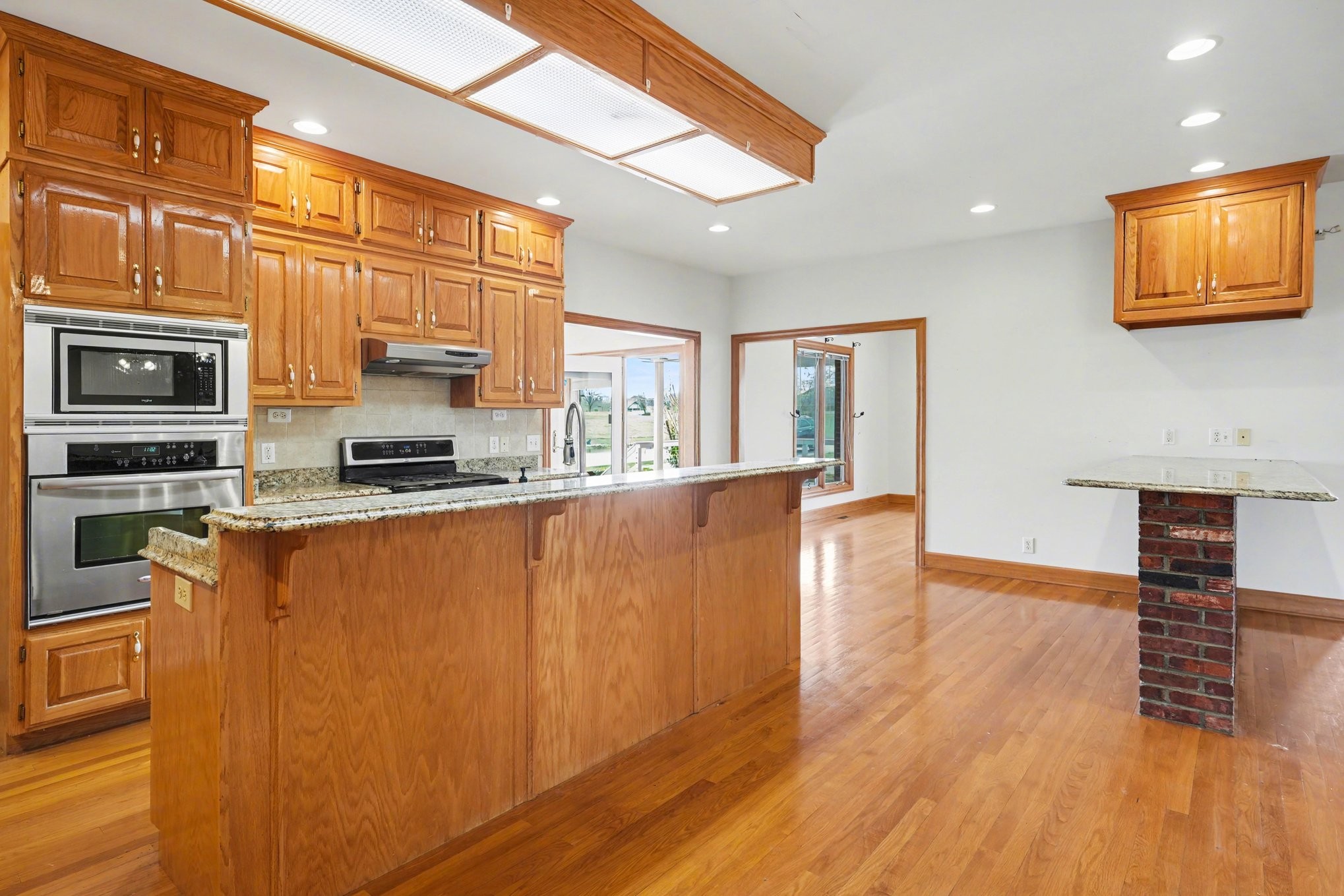 11948 Betts Road Greenbrier, TN 37073 - Photo 14 of 44 a kitchen with stainless steel appliances a refrigerator stove top oven a sink and dishwasher