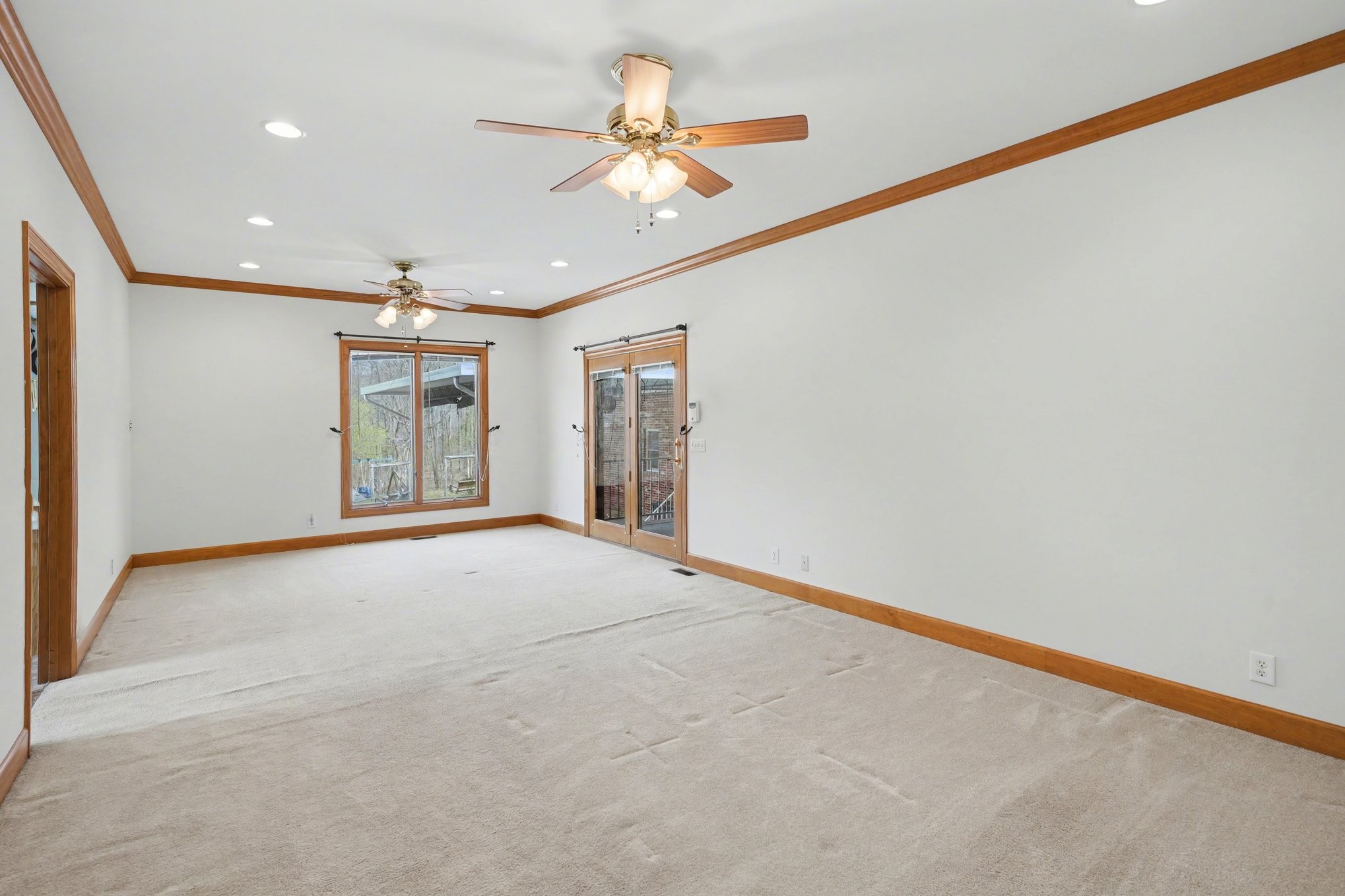 11948 Betts Road Greenbrier, TN 37073 - Photo 22 of 44 a view of an empty room with a ceiling fan