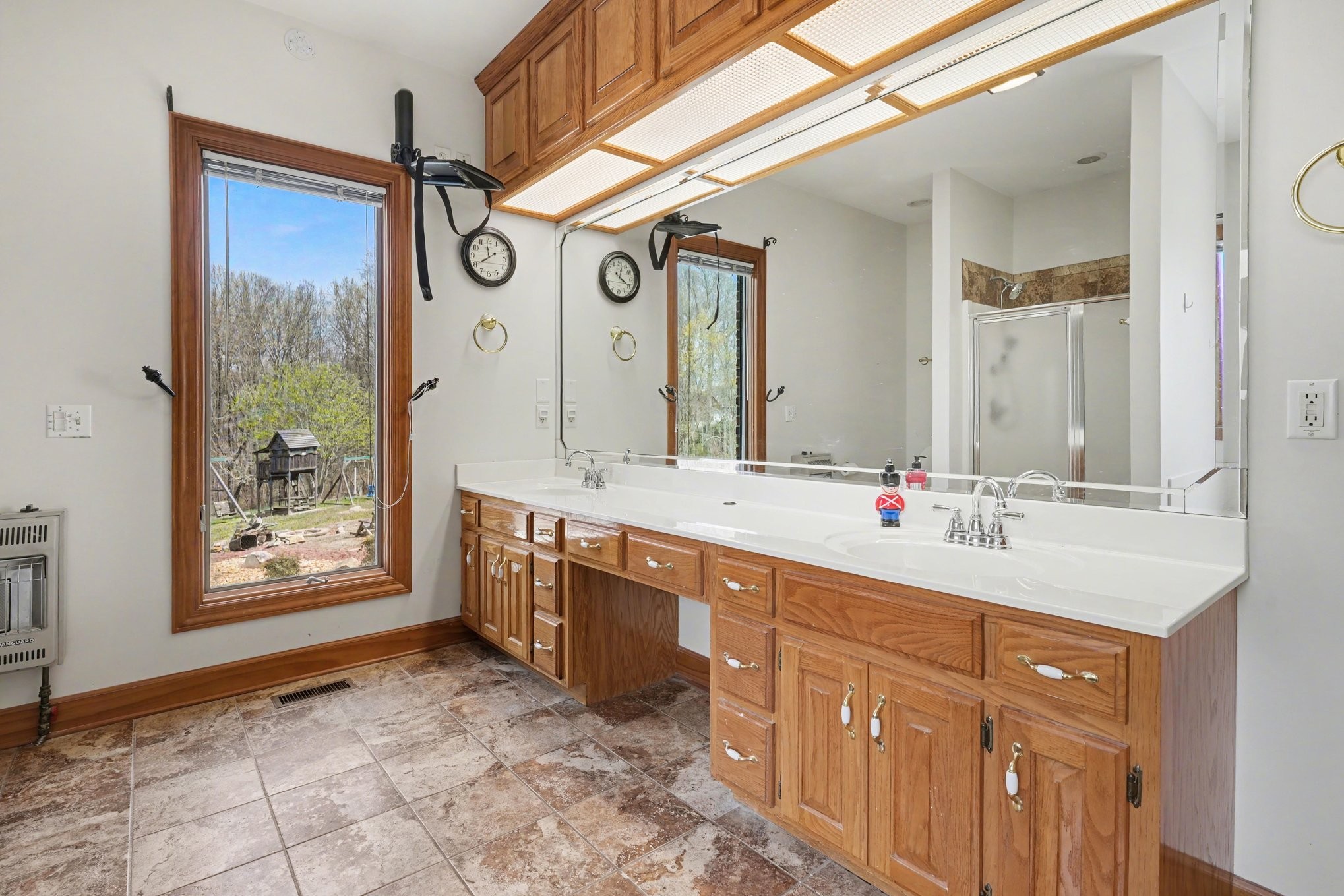 11948 Betts Road Greenbrier, TN 37073 - Photo 31 of 44 a spacious bathroom with a double vanity sink and a mirror