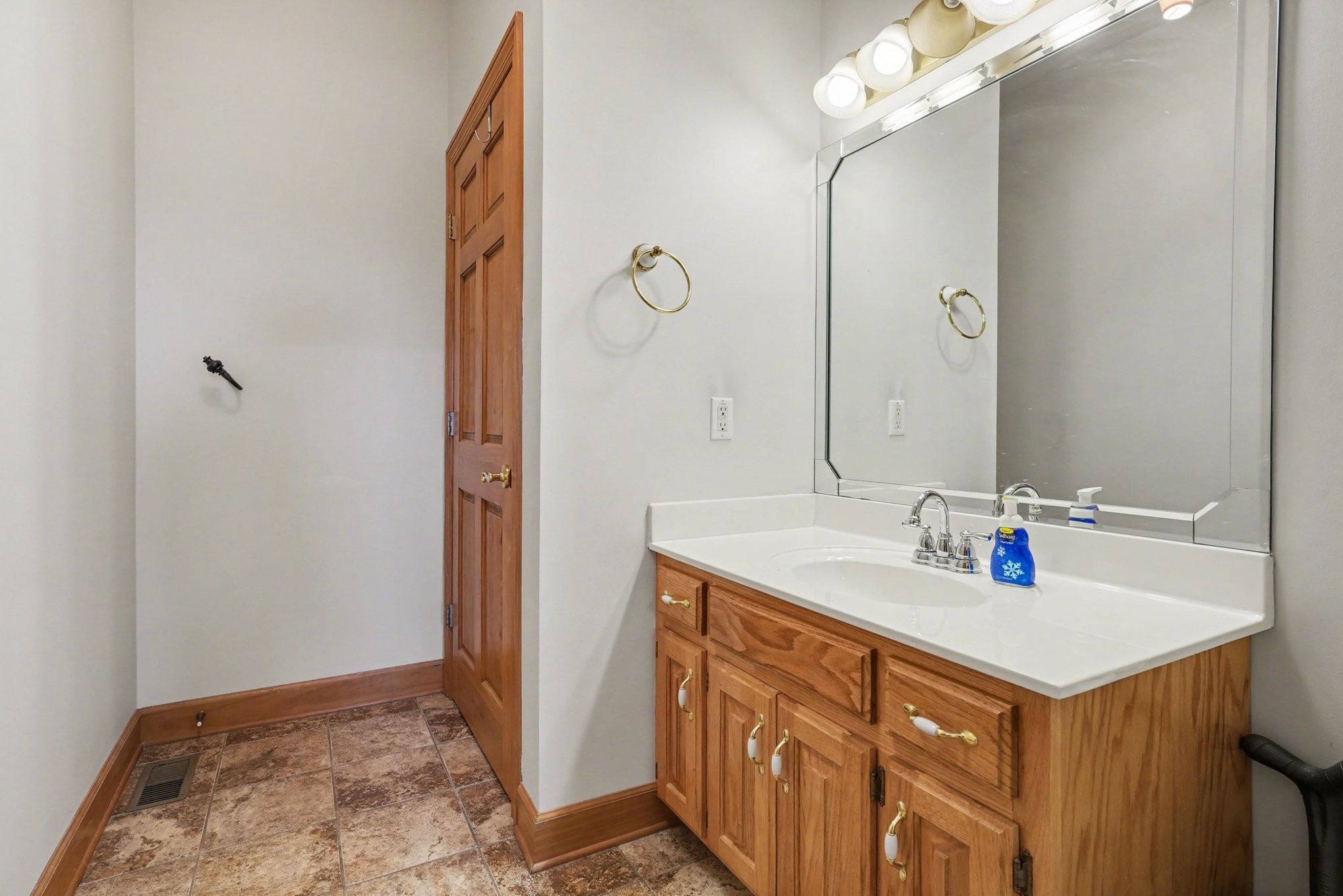 11948 Betts Road Greenbrier, TN 37073 - Photo 32 of 44 a bathroom with a sink vanity and a mirror
