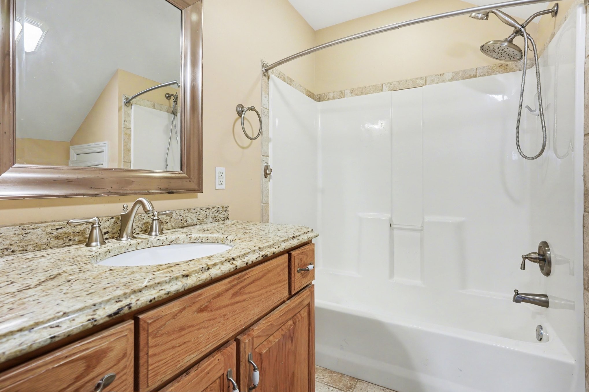 11948 Betts Road Greenbrier, TN 37073 - Photo 33 of 44 a bathroom with a granite countertop sink mirror and a bathtub