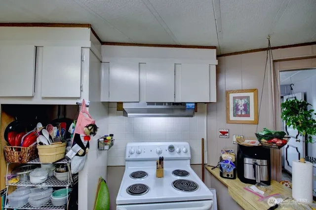 a bedroom with furniture and a flat screen tv
