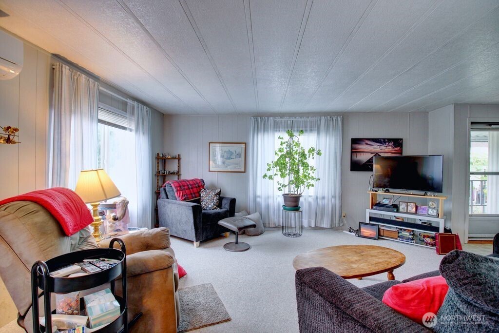 920 Maple Street, Unit 3 Sedro-Woolley, WA 98284 - Photo 10 of 18 a living room with furniture and a flat screen tv