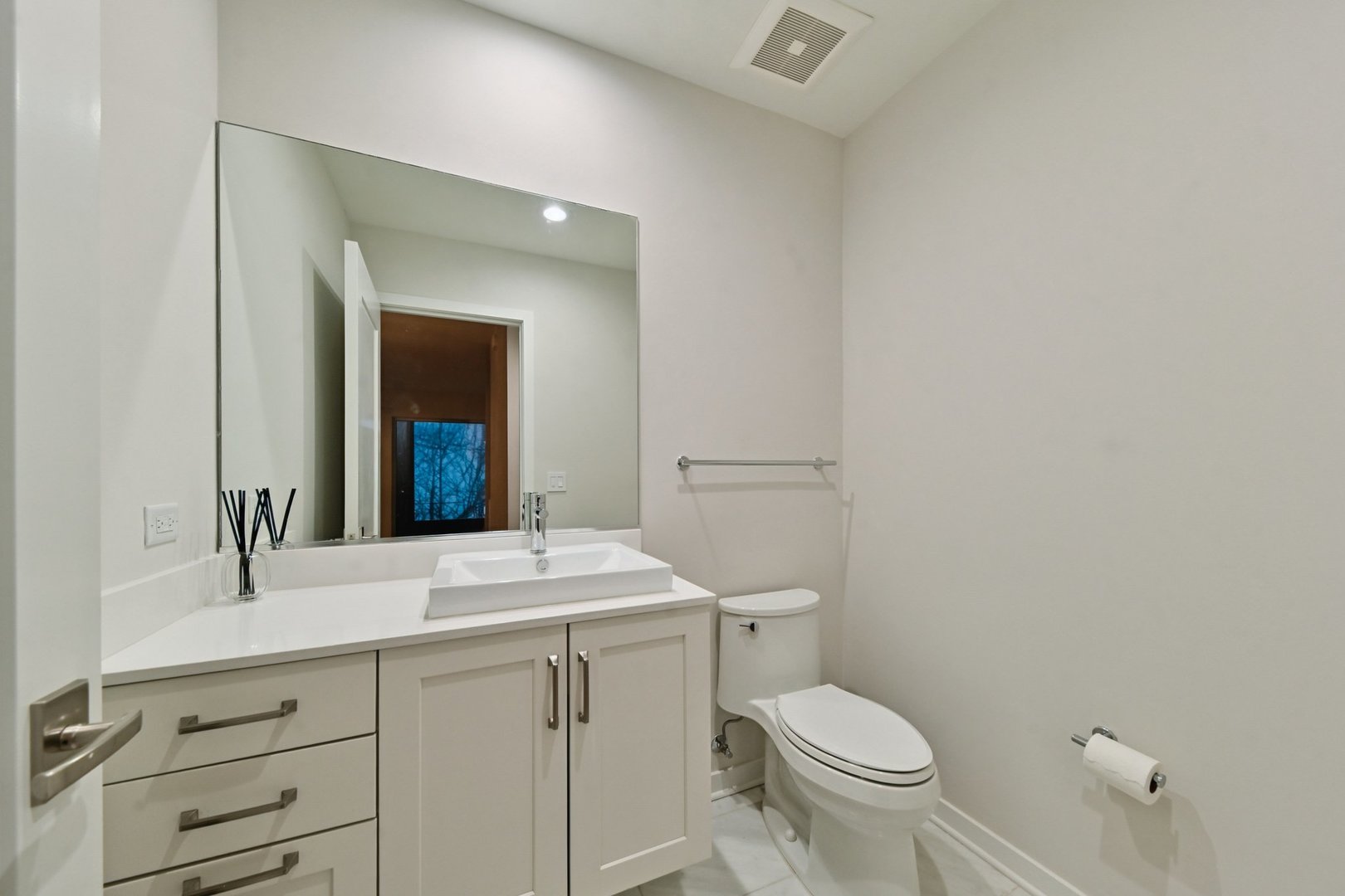 1640 South Prairie Avenue Chicago, IL 60616 - Photo 11 of 34 a bathroom with a granite countertop toilet sink and mirror