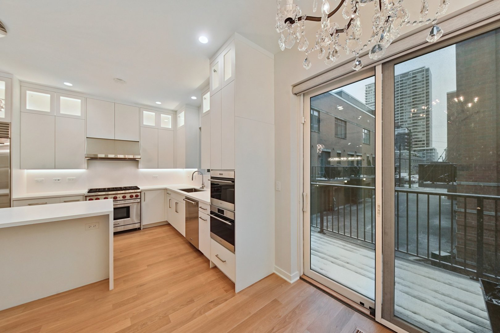 1640 South Prairie Avenue Chicago, IL 60616 - Photo 12 of 34 a kitchen with granite countertop a stove top oven and sink