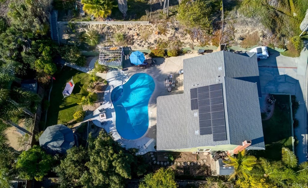 2024 Aura Circle Carlsbad, CA 92008 - Photo 1 of 1 an aerial view of a house with a yard and large trees