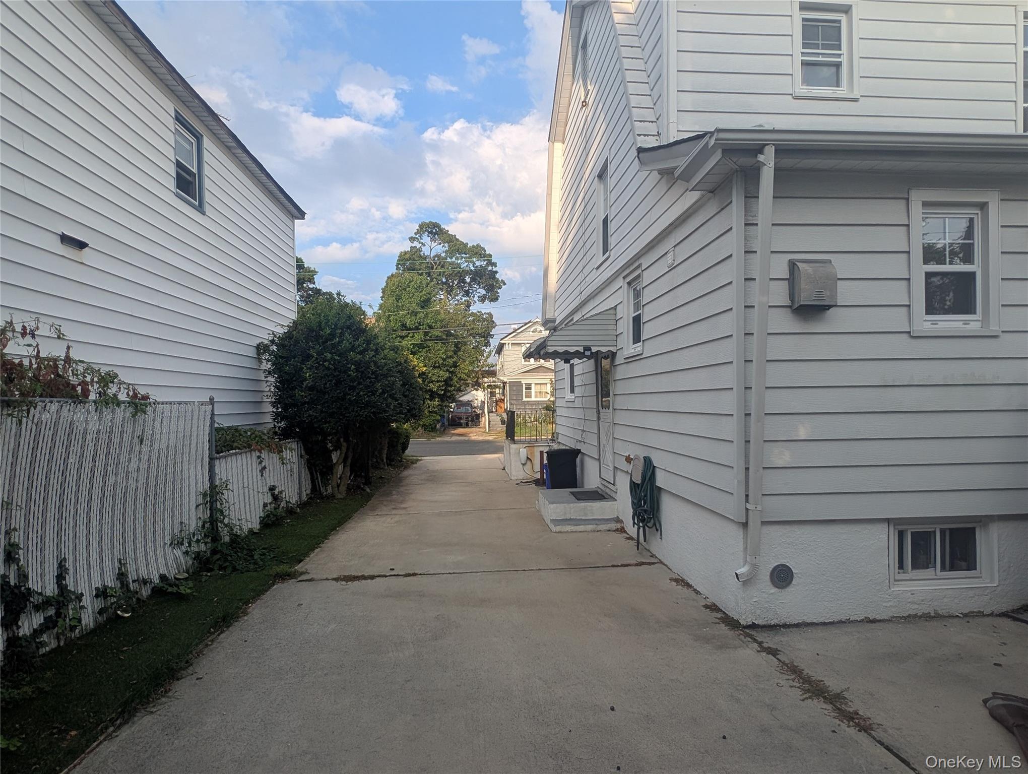 81 Cochran Place Valley Stream, NY 11581 - Photo 11 of 12 a view of a house with a yard