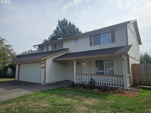 a view of a backyard with a small cabin
