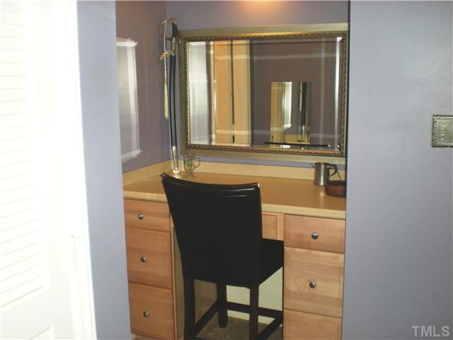3417 Hackney Court Raleigh, NC 27613 - Photo 17 of 23 This view shows the built-in desk or vanity area in the secondary bedroom, with corian surface and extra storage. Bedroom