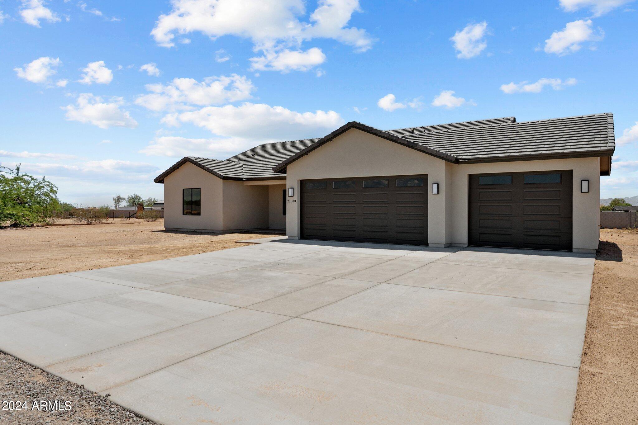 21033 West Skinner Road Wittmann, AZ 85361 - Photo 1 of 35 1-web-or-mls-2024-07-02 01.25.21-1