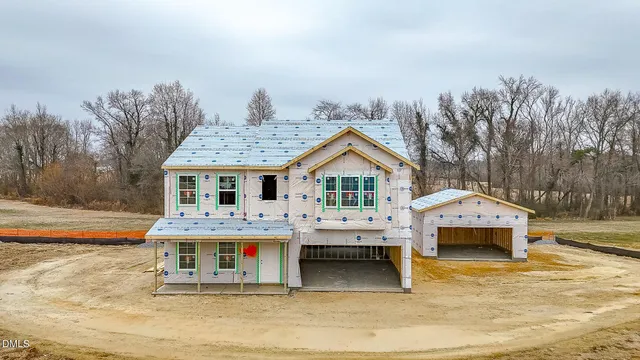 a front view of residential houses with yard