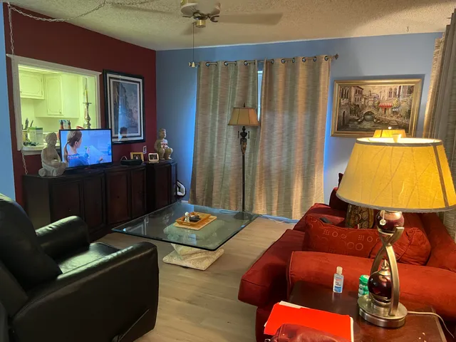 a living room with furniture and a table