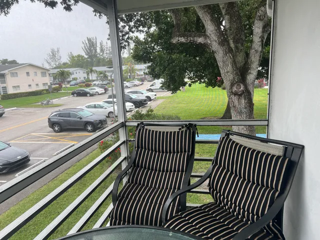 a view of outdoor space with deck and furniture