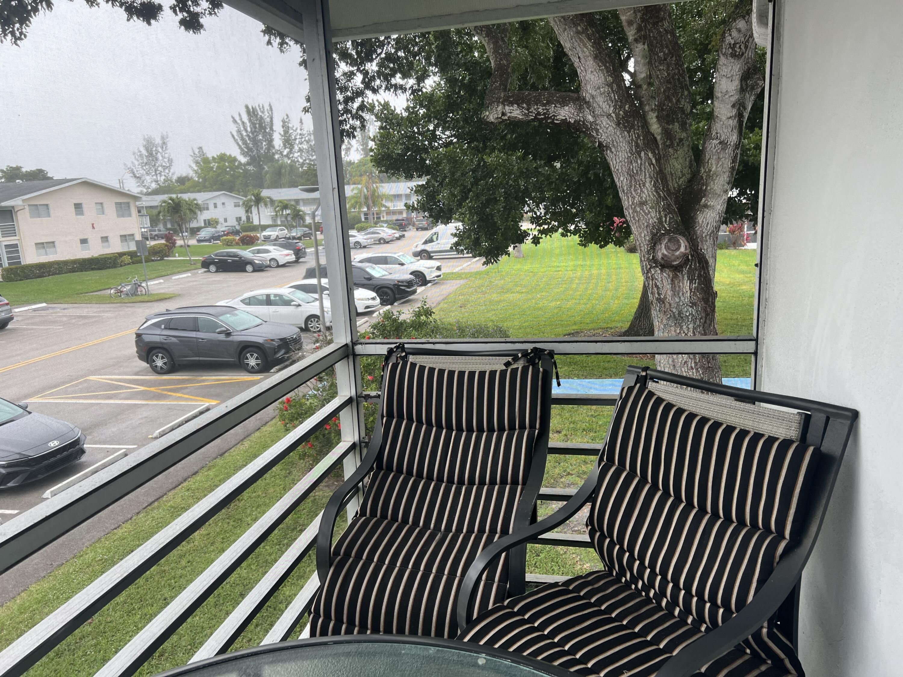 313 Durham Circle Deerfield Beach, FL 33442 - Photo 9 of 9 a view of outdoor space with deck and furniture