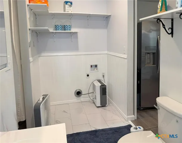 a bathroom with a sink and toilet