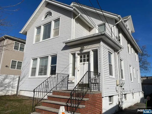 a front view of a house with a balcony