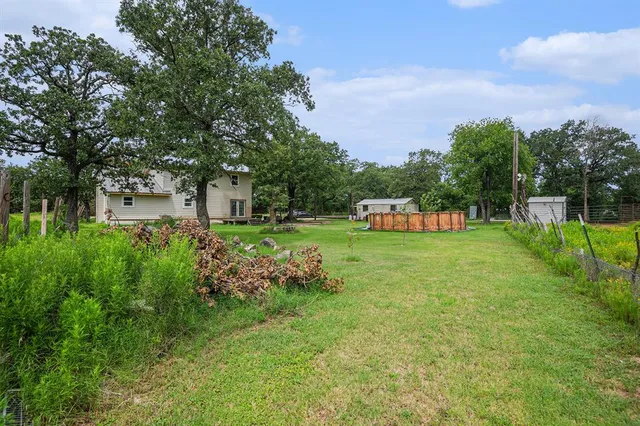a view of a house with a back yard