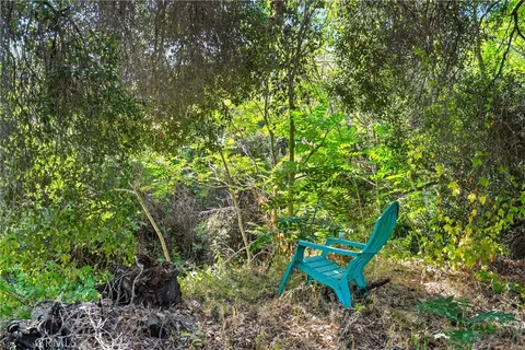 a view of outdoor space with deck and yard