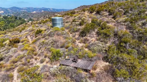 a view of a house with a tree