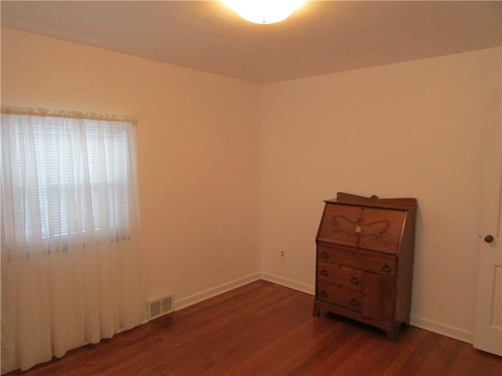 1136 Varner Road Whitehall, PA 15227 - Photo 22 of 25 Fourth bedroom is light and bright, with neutral walls and gleaming hardwood floors.