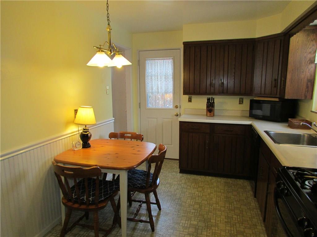 1136 Varner Road Whitehall, PA 15227 - Photo 8 of 25 Eat-in-kitchen has custom solid wood cabinets. Refrigerator is about 1 year old. Gas stove, dishwasher and disposal included. Cute bead board treatment on wall.