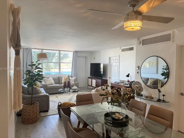 a dining room with furniture and window