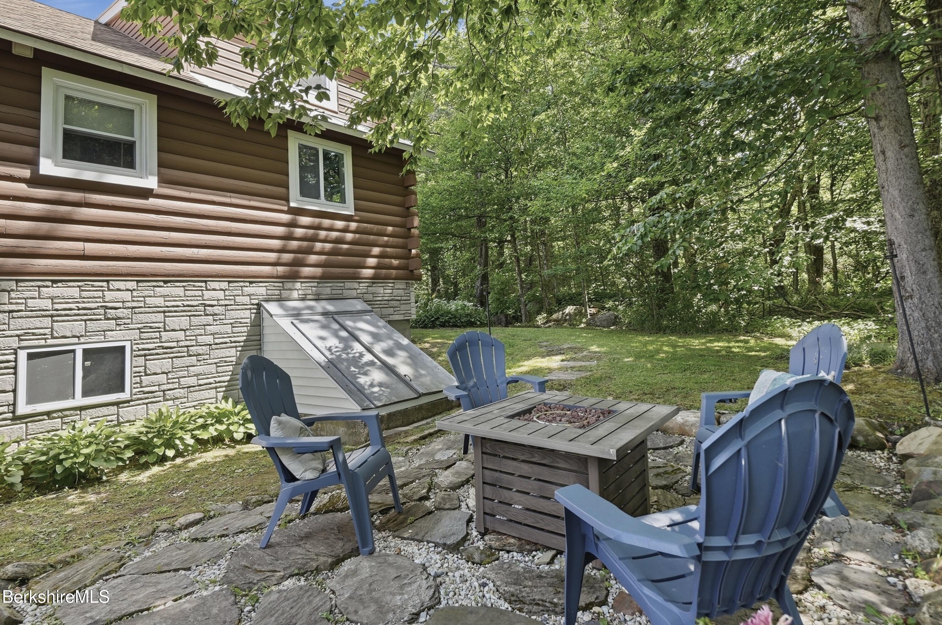 4 David Drive Peru, MA 01235 - Photo 34 of 44 a view of a chairs and table in backyard of the house