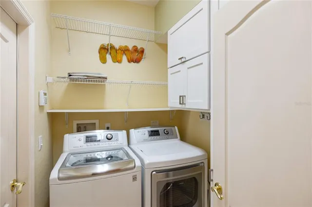 a utility room with dryer and washer