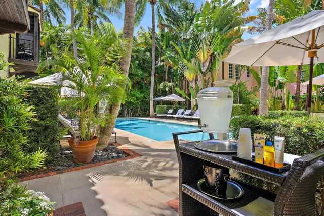 a view of a backyard with sitting area
